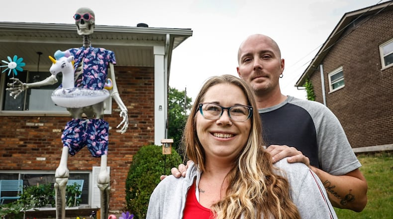 Cyndi White and Jason Thurman are owners of Frank the skeleton on North Heincke Road in Miamisburg. Frank is a Halloween decoration but the couple dress him up for all the holidays and leave him in the yard. JIM NOELKER/STAFF