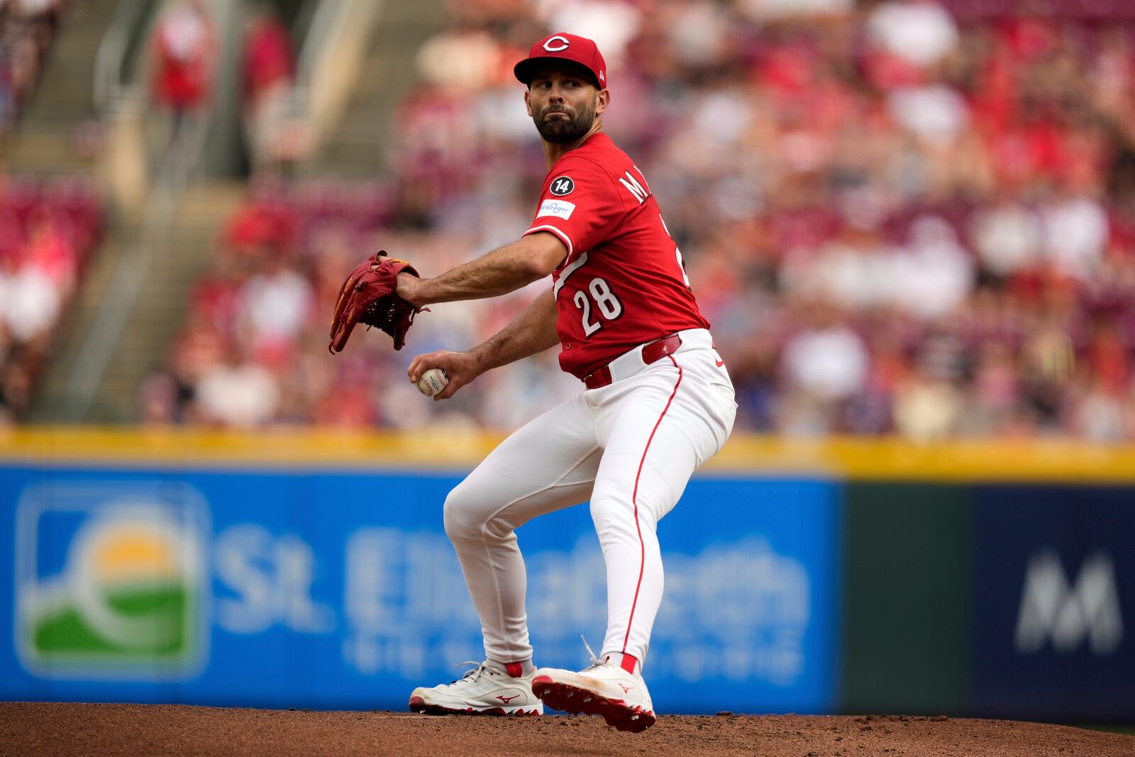 Cincinnati Reds' Nick Martinez thorws during the first inning of a baseball game against the Los Angeles Dodgers Wednesday, July 30, 2025, in Cincinnati. (AP Photo/Carolyn Kaster)