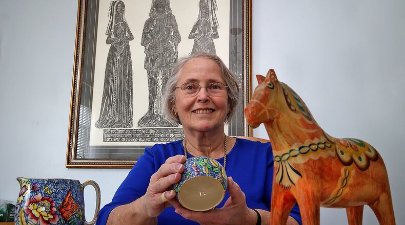 Virginia Weygandt with some of her family heirlooms from Sweden Tuesday. BILL LACKEY/STAFF