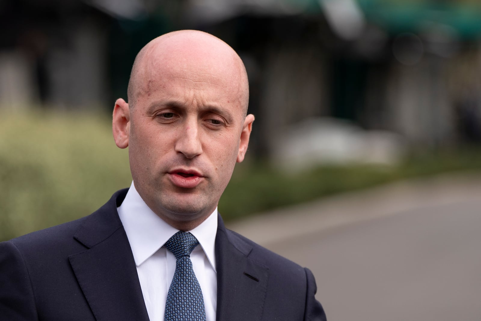 White House deputy chief of policy Stephen Miller speaks with reporters at the White House, Monday, April 14, 2025, in Washington. (AP Photo/Alex Brandon)
