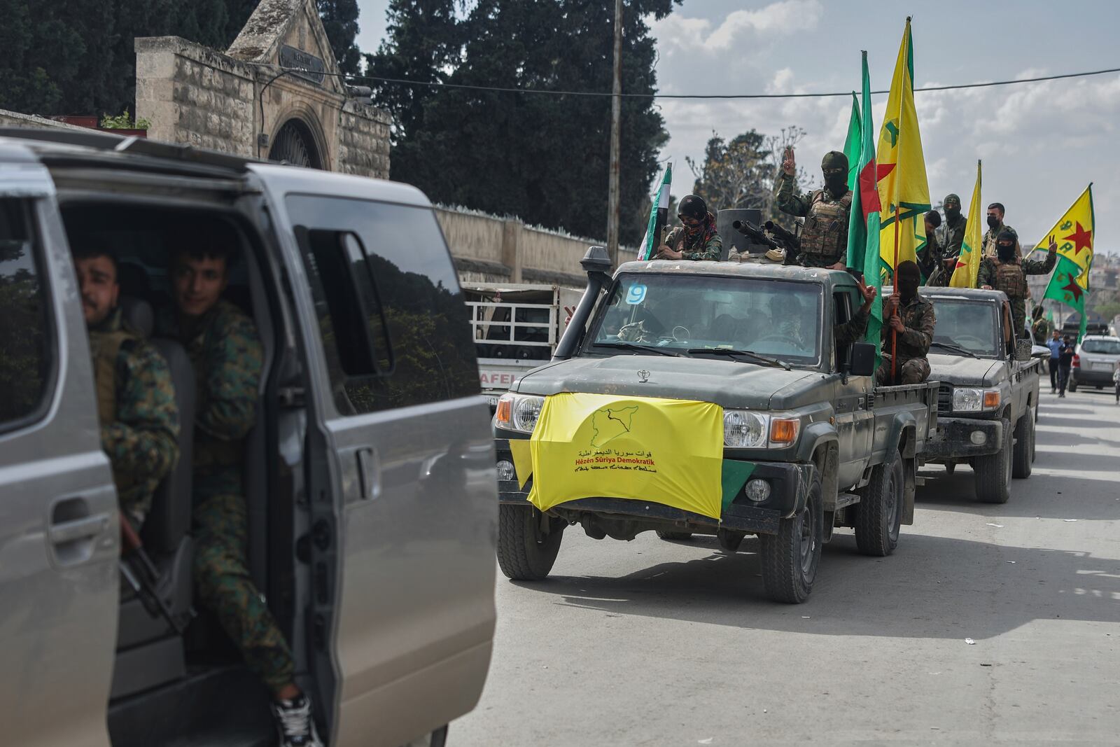 U.S.-backed Kurdish fighters withdraw from two neighbourhoods in Syria's northern city of Aleppo as part of a deal with the Syrian central government, in Aleppo, Syria, Friday, April 4, 2025. (AP Photo/Ghaith Alsayed)