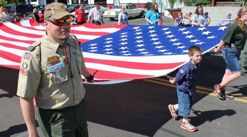 Memorial Day parade participants carry the American flag up Fountain Ave. The route to the parade will be changing this year. JEFF GUERINI/STAFF