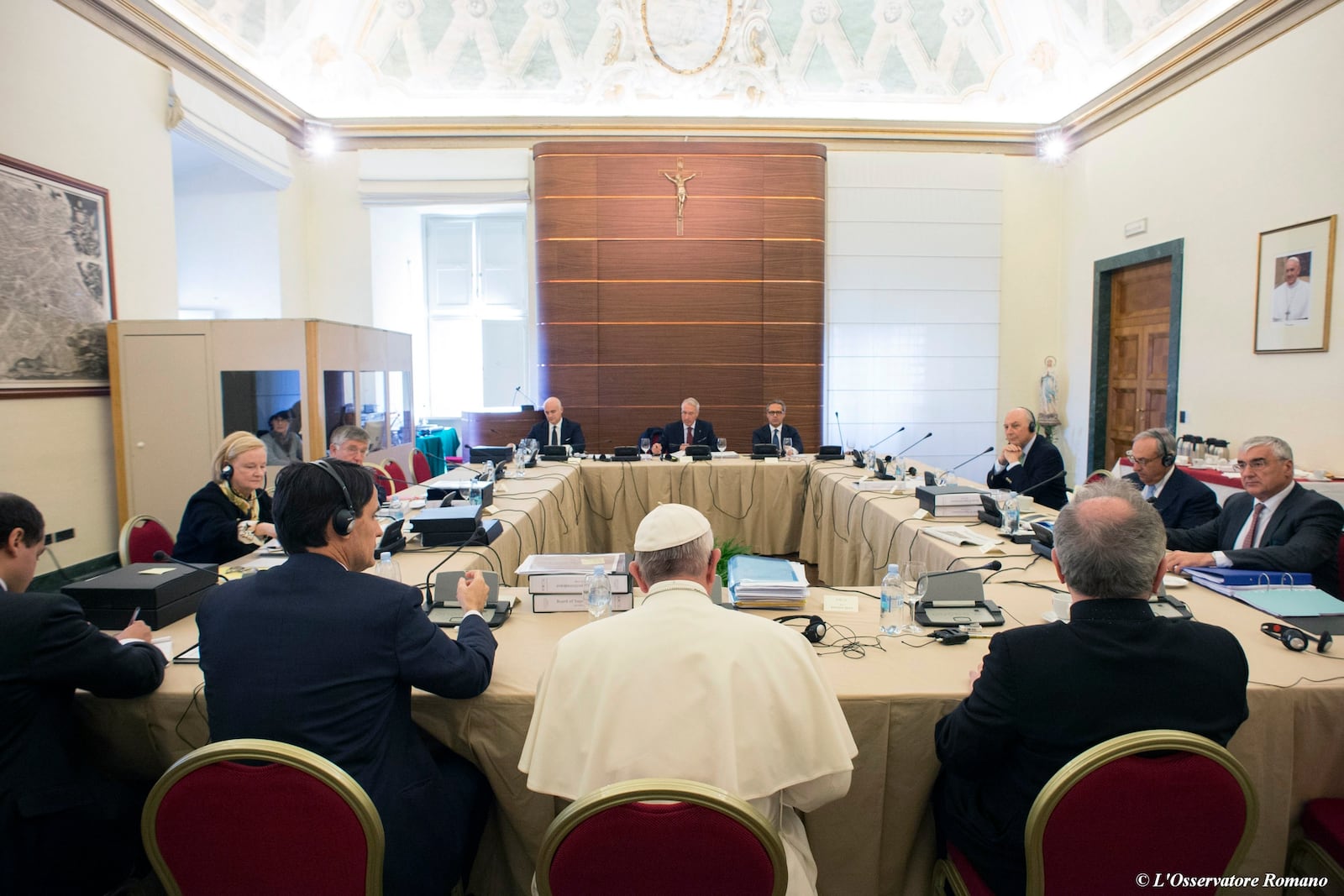 FILE - Pope Francis attends the IOR (Institute for Religious Works) Vatican Bank's council, at the Vatican, Tuesday, Nov. 24, 2015. (L'Osservatore Romano/Pool Photo via AP)