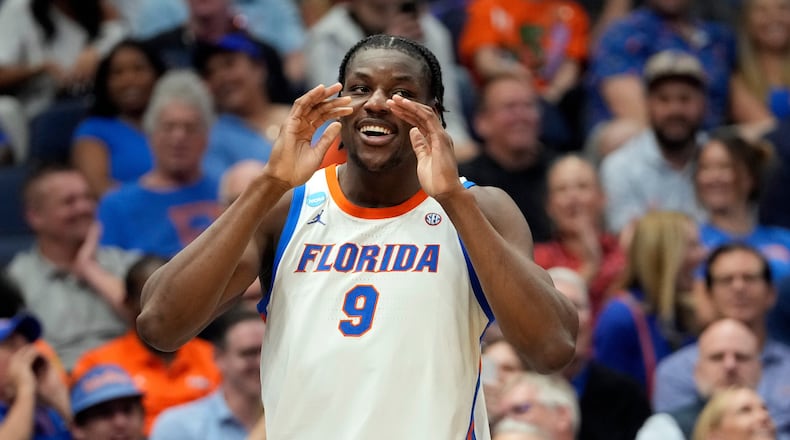 Florida center Rueben Chinyelu (9) celebrates during the second half in the first round of the NCAA college basketball tournament against Prairie View A M Friday, March 20, 2026, in Tampa, Fla. (AP Photo/Chris O'Meara)