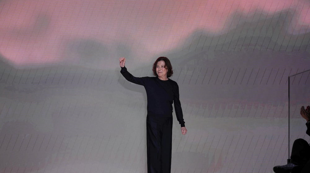 Silvana Armani is greeted by the public at the end of the Giorgio Armani Fall/Winter 2026-2027 Women's collection presented in Milan, Italy, Sunday, March 1, 2026. (AP Photo/Antonio Calanni)