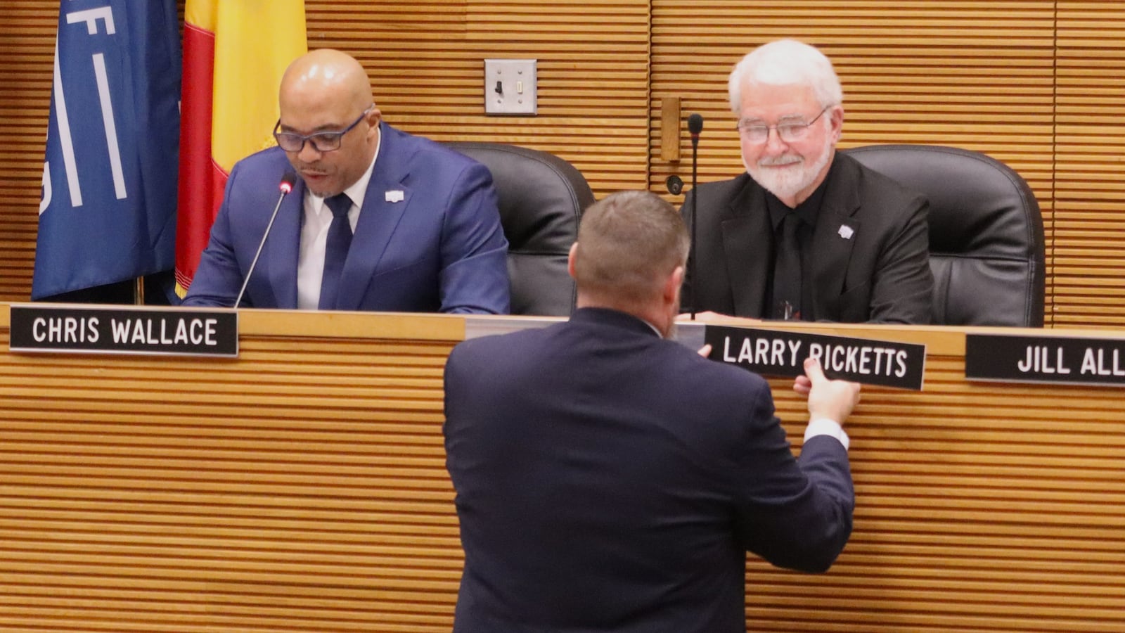 Springfield City Manager Bryan Heck installs Commissioner Larry Ricketts' nameplate Friday, Jan. 2, 2026. JESSICA OROZCO/STAFF