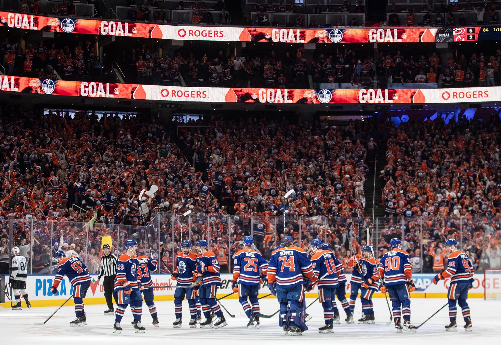 Edmonton Oilers players celebrate the win over the Los Angeles Kings during an overtime of an NHL playoff game in Edmonton on Sunday, April 27, 2025. (Jason Franson/The Canadian Press via AP)
