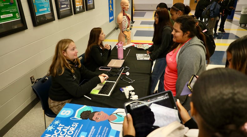 Second-year medical students from The Ohio State University, Emily Stanciu and Anna Ryder, talk with Springfield High School students about a new Medical Mentorship program. PHOTO CONTRIBUTED BY SPRINGFIELD HIGH SCHOOL.