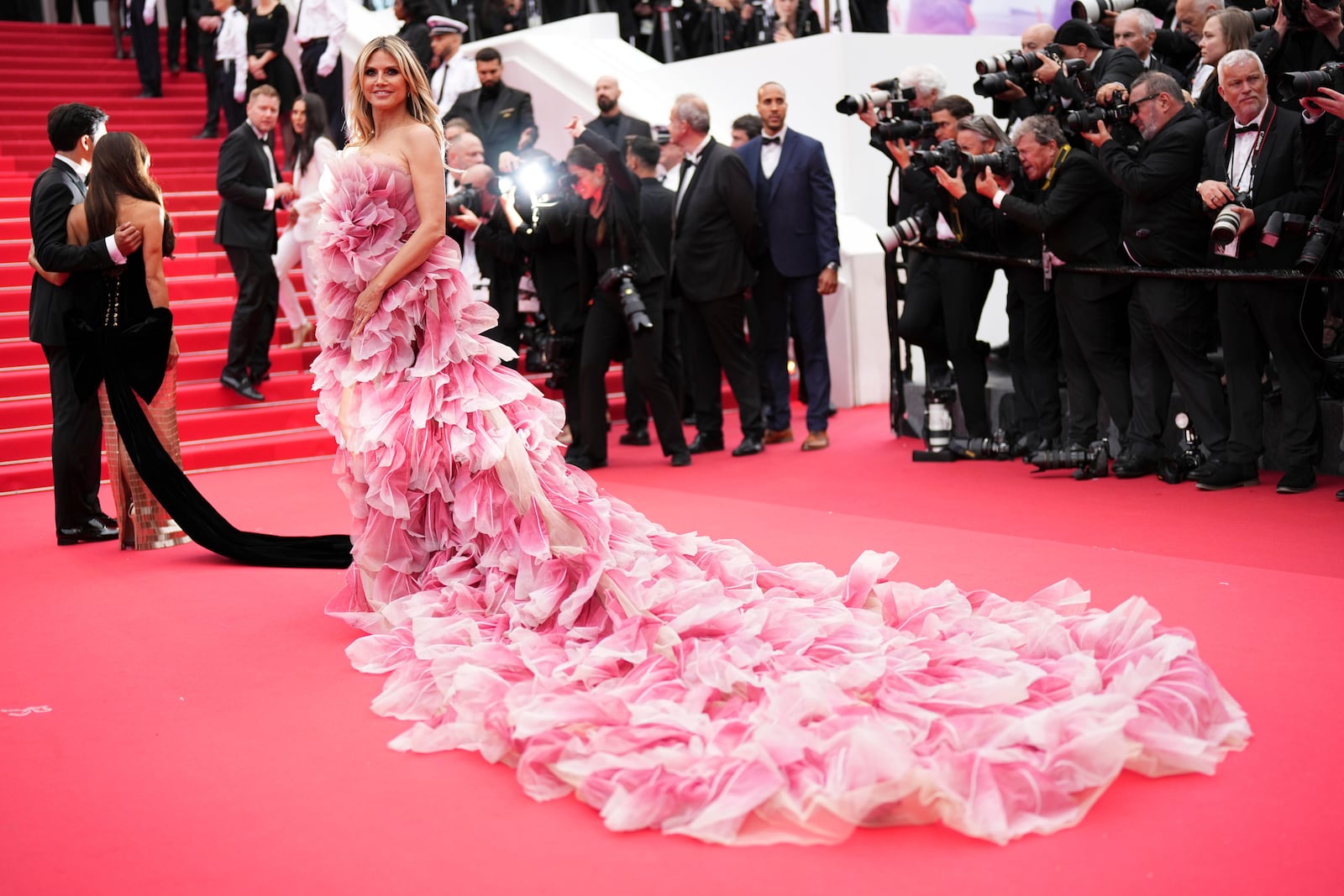 Heidi Klum poses for photographers during the opening ceremony red carpet of the 78th international film festival, Cannes, southern France, Tuesday, May 13, 2025. (Photo by Scott A Garfitt/Invision/AP)