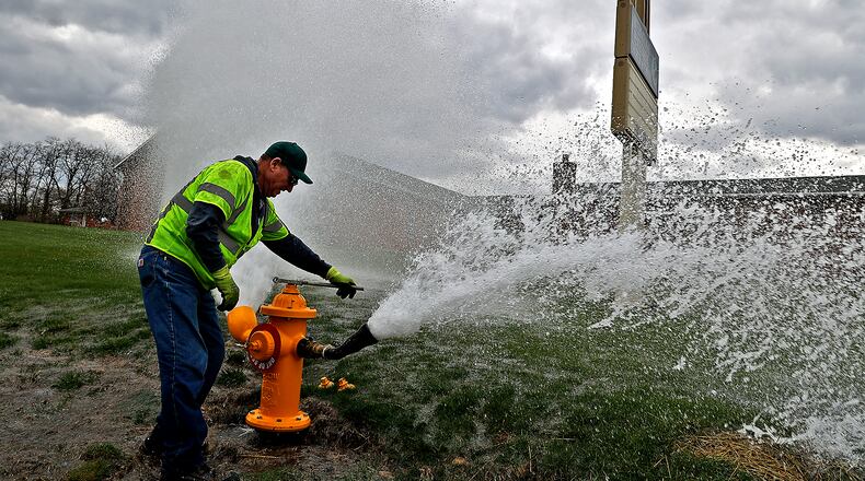 City of Springfield Service Department employee Gary Beaver turns off a fire hydrant along Burma Road Tuesday, March 28, 2023, after flushing the water lines. The city will spend about $18 million on infrastructure work after a vote Tuesday, Jan. 30, 2024. BILL LACKEY/STAFF