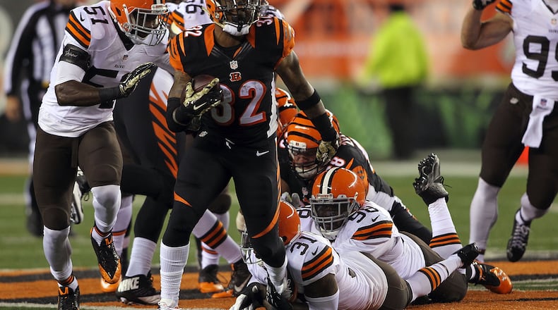 Jeremy Hill #32 of the Cincinnati Bengals breaks the tackle by Donte Whitner #31 of the Cleveland Browns during the first quarter at Paul Brown Stadium on Nov. 6, 2014, in Cincinnati. (Photo by John Grieshop/Getty Images)