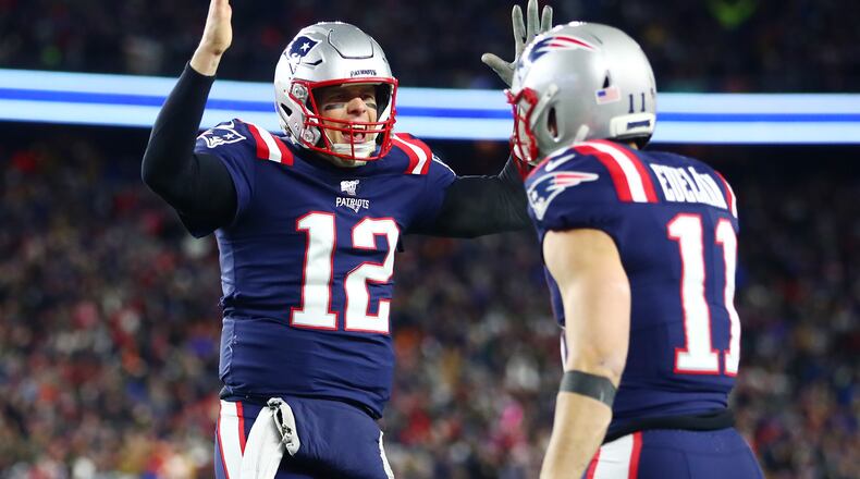 FOXBOROUGH, MASSACHUSETTS - DECEMBER 08: Tom Brady #12 of the New England Patriots signals for a touchdown during the second half against the Kansas City Chiefs in the game at Gillette Stadium on December 08, 2019 in Foxborough, Massachusetts. (Photo by Adam Glanzman/Getty Images)
