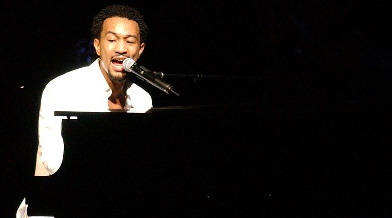 John Legend performs on the opening night of the Veterans Park Amphitheater in Springfield on Tuesday, July 26, 2005. FILE