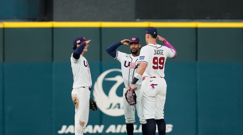 United States outfielders Roman Anthony, left to right, Byron Buxton and Aaron Judge celebrate after the team's victory over Mexico in a World Baseball Classic game, Monday, March 9, 2026, in Houston. (AP Photo/Ashley Landis)
