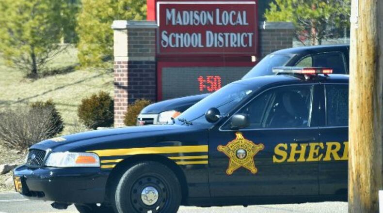 Butler County sheriffs deputies block the Ohio 122 entrance to Madison Jr./Sr. High School on Monday, Feb. 29 after a school shooting. NICK GRAHAM/STAFF