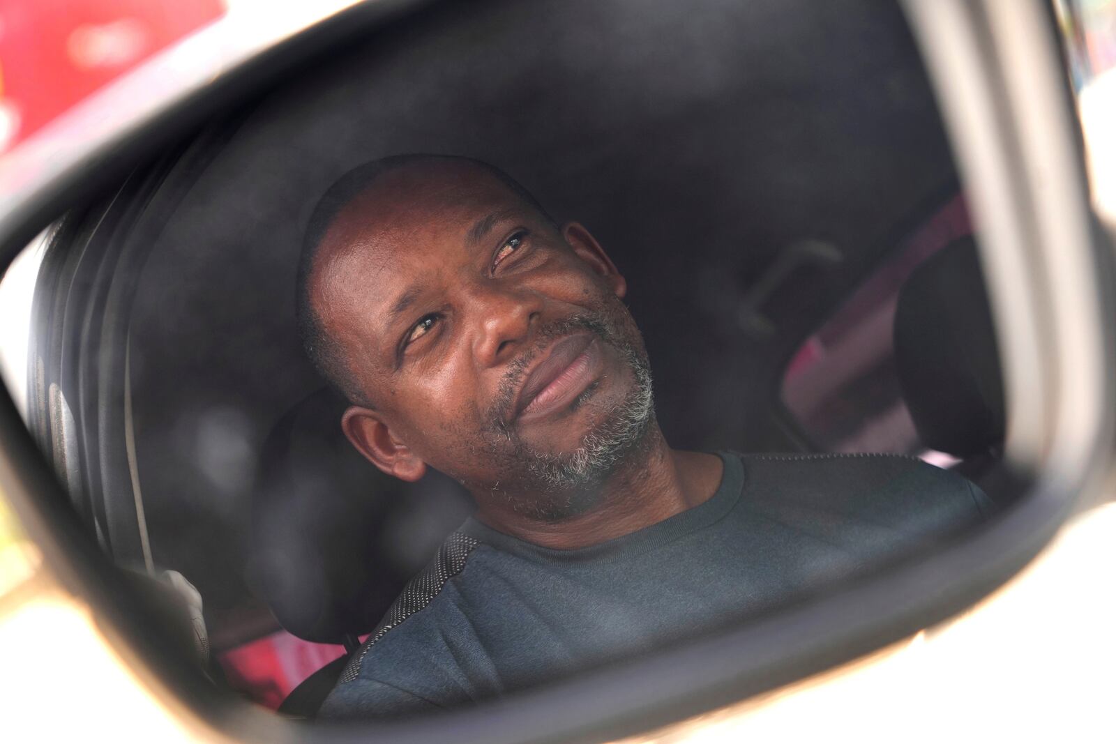 Luizmar Santana Pereira, a former Ford employee who registered for a job with BYD, attends an interview with The Associated Press, in Camacari, Bahia state, Brazil, Saturday, March 8, 2025. (AP Photo/Eraldo Peres)