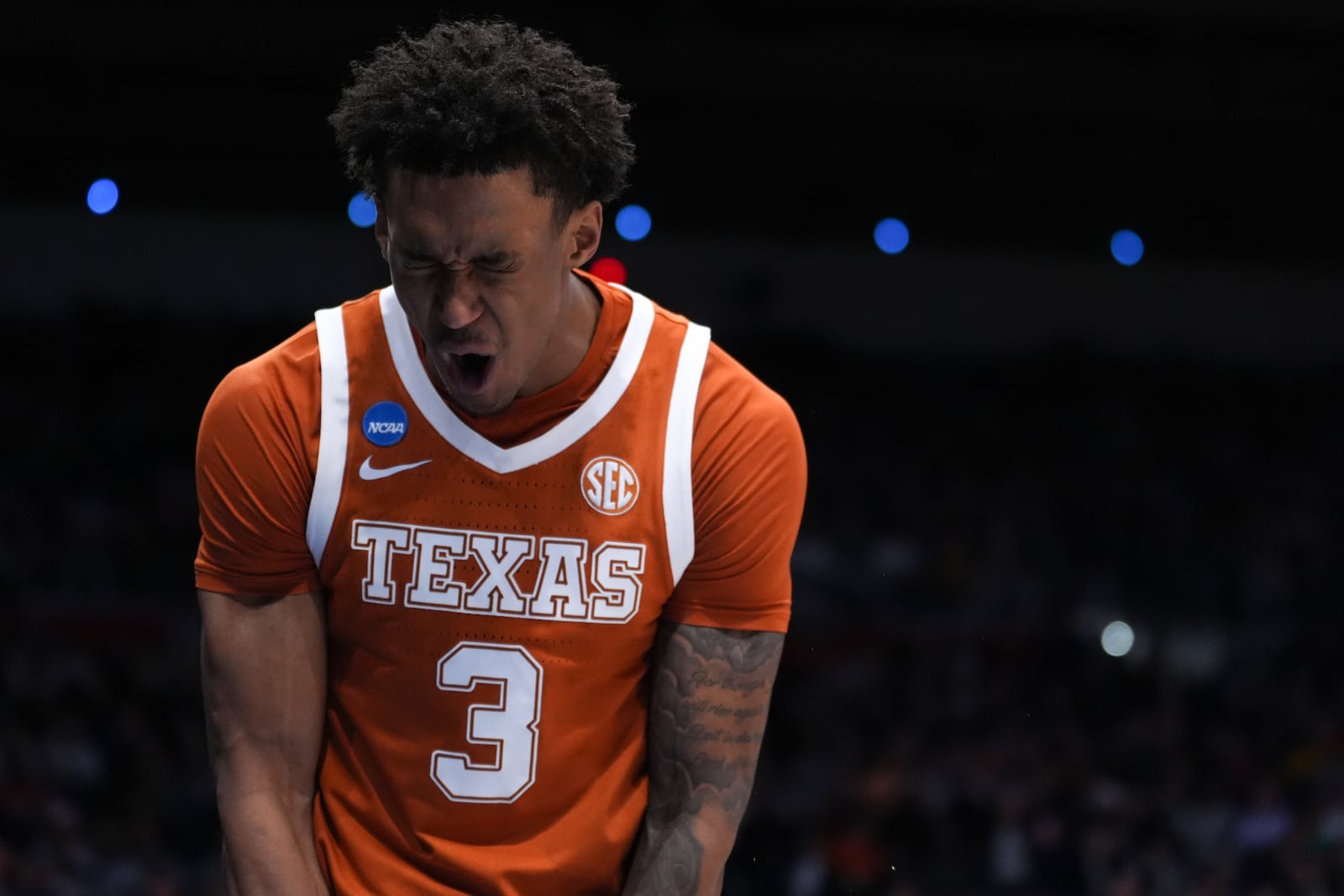 Texas Longhorns forward Dailyn Swain (3) reacts after a making a basket and drawing a foul during the second half in a First Four college basketball game in the NCAA Tournament against North Carolina State, Tuesday, March 17, 2026, in Dayton, Ohio. (AP Photo/Kareem Elgazzar)