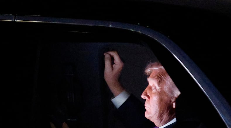 President Donald Trump is seen in his limousine, known as "The Beast," for the motorcade to the White House after his arrival on Air Force One at Joint Base Andrews, Md., Wednesday, March 11, 2026. (AP Photo/Luis M. Alvarez)