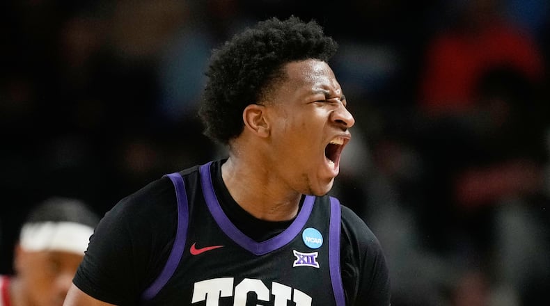 TCU forward Xavier Edmonds (24) celebrates scoring during the first half in the first round of the NCAA college basketball tournament against Ohio State, Thursday, March 19, 2026, in Greenville, S.C. (AP Photo/Brynn Anderson)