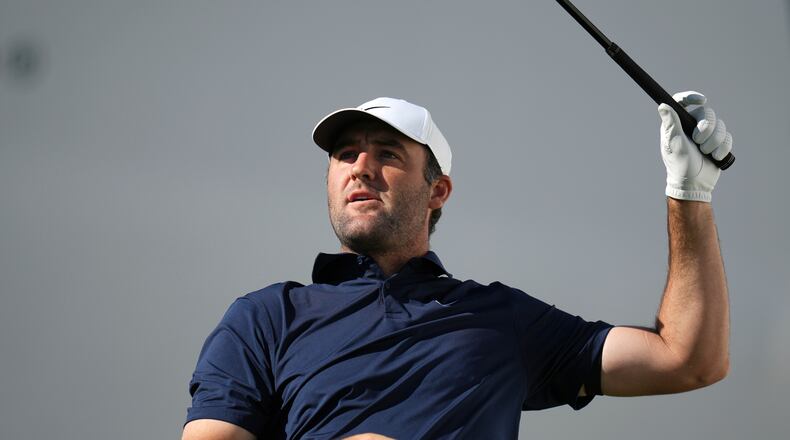 Scottie Scheffler watches his tee shot at the 17th hole during the first round of the Phoenix Open golf tournament at the TPC Scottsdale Stadium Course Thursday, Feb. 5, 2026, in Scottsdale, Ariz. (AP Photo/Ross D. Franklin)