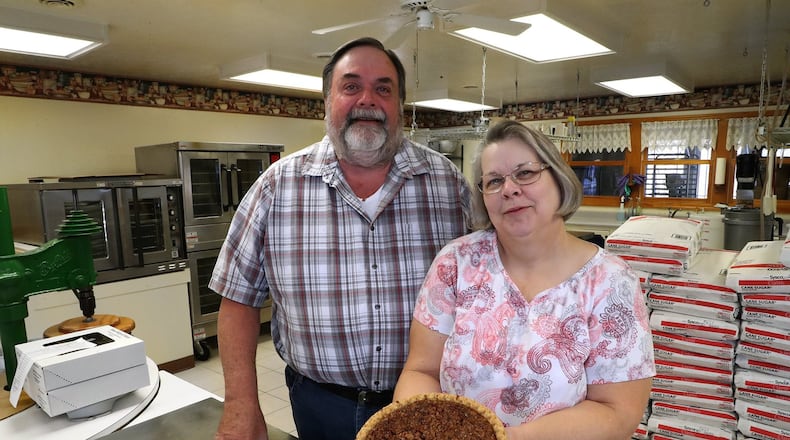 Chris and Sharon Stevens in their commercial kitchen where they make more than 20 varieties of pies. BILL LACKEY/STAFF