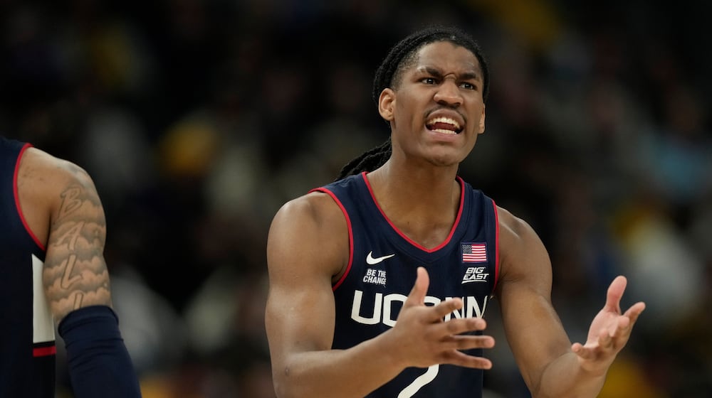 UConn's Silas Demary Jr. reacts during the first half of an NCAA college basketball game against Marquette, Saturday, March 7, 2026, in Milwaukee. (AP Photo/Aaron Gash)