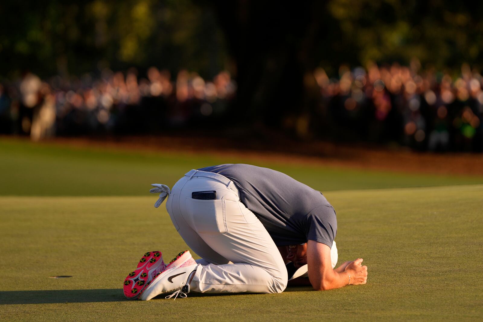 Rory McIlroy, of Northern Ireland, celebrates winning in a playoff against Justin Rose, of England, after the final round the Masters golf tournament, Sunday, April 13, 2025, in Augusta, Ga. (AP Photo/Julia Demaree Nikhinson)
