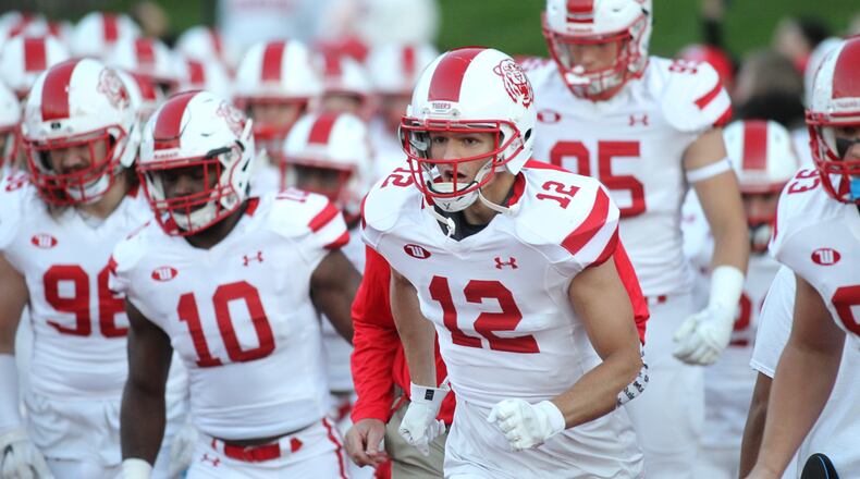 Wittenberg players take the field before a game against Denison on Sept. 29, 2018, in Granville. David Jablonski/Staff