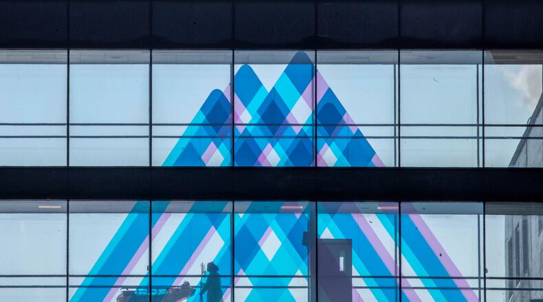 FILE - A medical worker transports a patient at Mount Sinai Hospital, April 1, 2020, in New York. (AP Photo/Mary Altaffer, File)