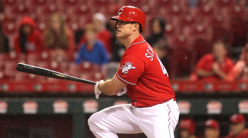 The Reds’ Scott Schebler singles against the Giants on Friday, May 5, 2017, at Great American Ball Park in Cincinnati. David Jablonski/Staff