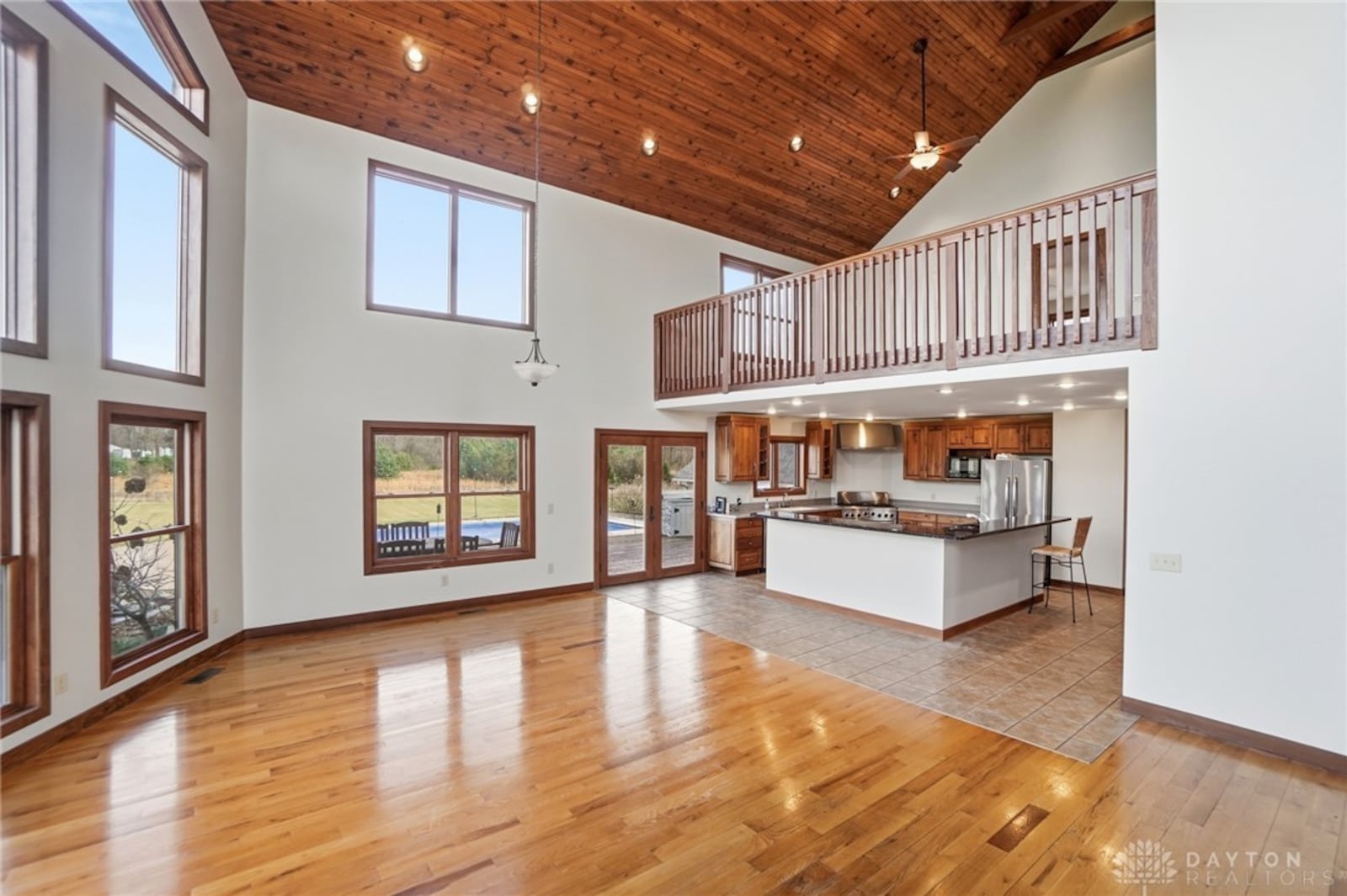 The gourmet style kitchen is open to the great room and has tile floors, professional style stainless appliances and an island with a breakfast bar. CONTRIBUTED