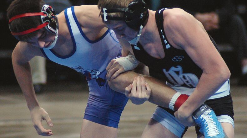 Devan Hendrix of Greeneview and Tanner Jordan of Graham (right) in the finals at 106 pounds at the GMVWA Holiday tournament at the Nutter Center earlier this season. Jordan won 15-0. John Cummings/Contributed