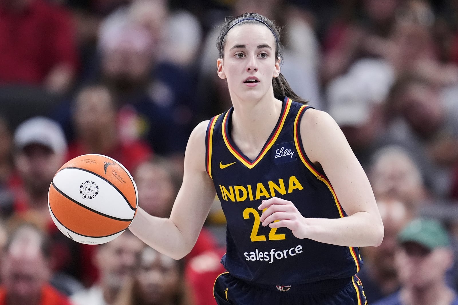 FILE - Indiana Fever guard Caitlin Clark (22) plays against the Dallas Wings in the second half of a WNBA basketball game in Indianapolis, Sunday, Sept. 15, 2024. (AP Photo/Michael Conroy, File)
