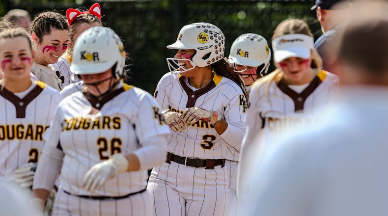 Kenton Ridge High School junior Cara Cammon celebrates with teammates after hitting a home run during their Division IV district final game against CHCA on Friday, May 23 at Valley View High School. The Cougars won 11-0. MICHAEL COOPER / STAFF