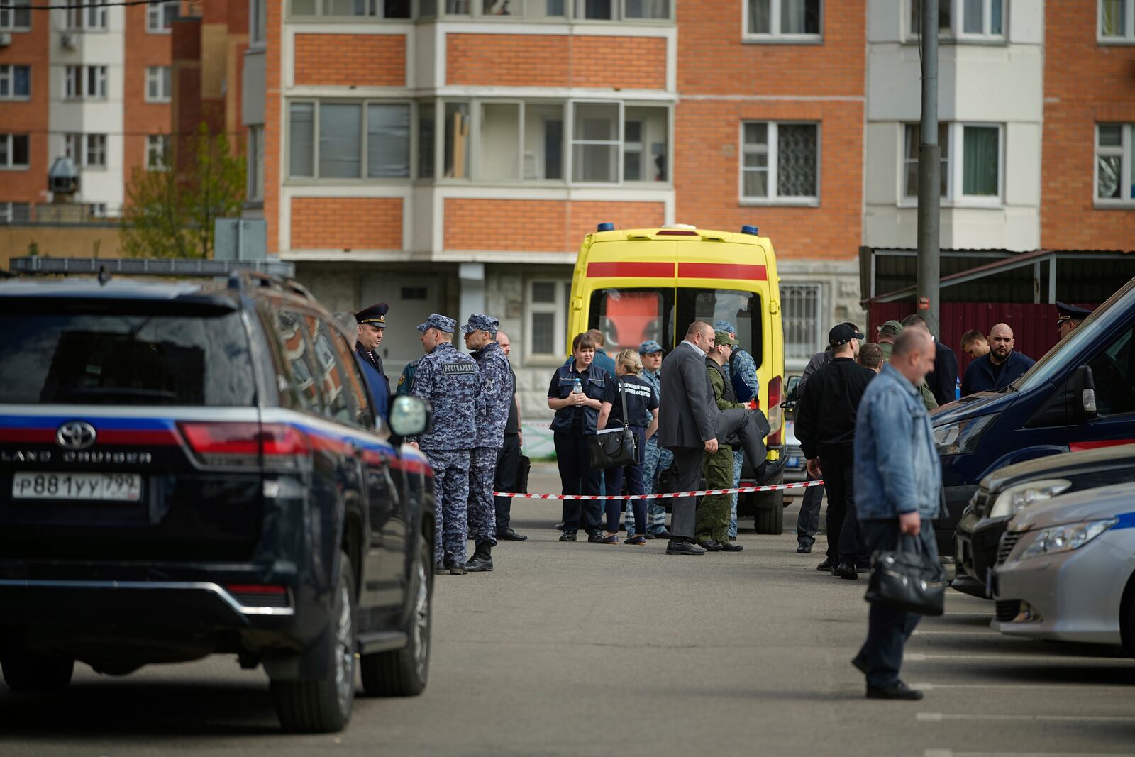 Police and investigators work at the scene where Lt. Gen. Yaroslav Moskalik, a deputy head of the main operational department in the General Staff of the Russian armed forces, was killed by an explosive device placed in his car in Balashikha, just outside Moscow, Russia, on Friday, April 25, 2025. (AP Photo)