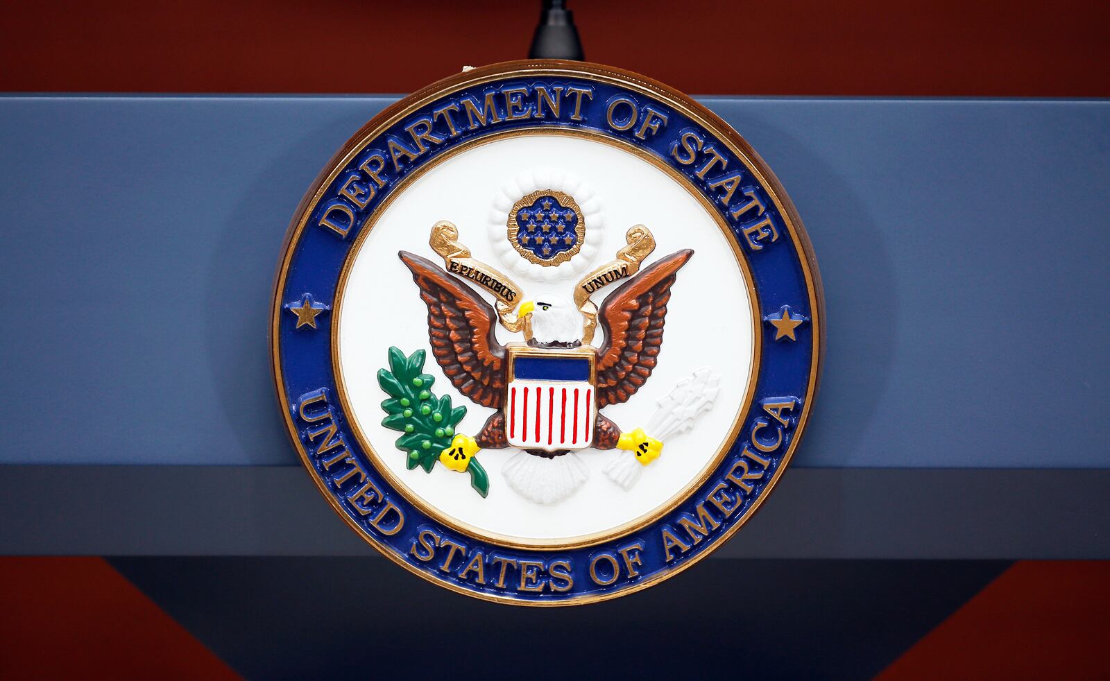 FILE - The seal of the State Department is seen at the Washington Passport Agency, July 12, 2016, in Washington. (AP Photo/Alex Brandon, File)