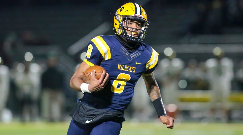Springfield High School quarterback Te'Sean Smoot runs the ball during their game against Dublin Jerome on Friday night in Springfield. Smoot threw four touchdowns and ran for another as Springfield won 34-0. CONTRIBUTED PHOTO BY MICHAEL COOPER