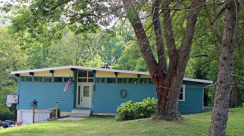 This 4-bedroom home offers about 1,400 sq. ft. of living space and sits on 4.49 acres, much of which is wooded. The home has an attached, 1-car garage. CONTRIBUTED PHOTO BY VICKIE KAPNAS