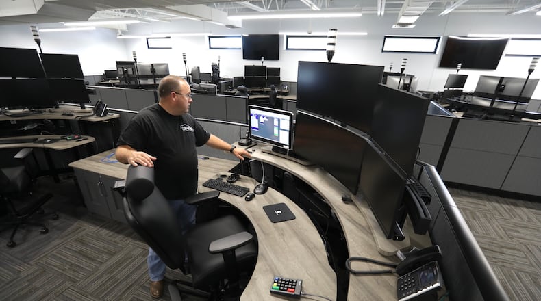 Major Chris Clark, of the Clark County Sheriff’s Department, talks about the new dispatch center. BILL LACKEY/STAFF