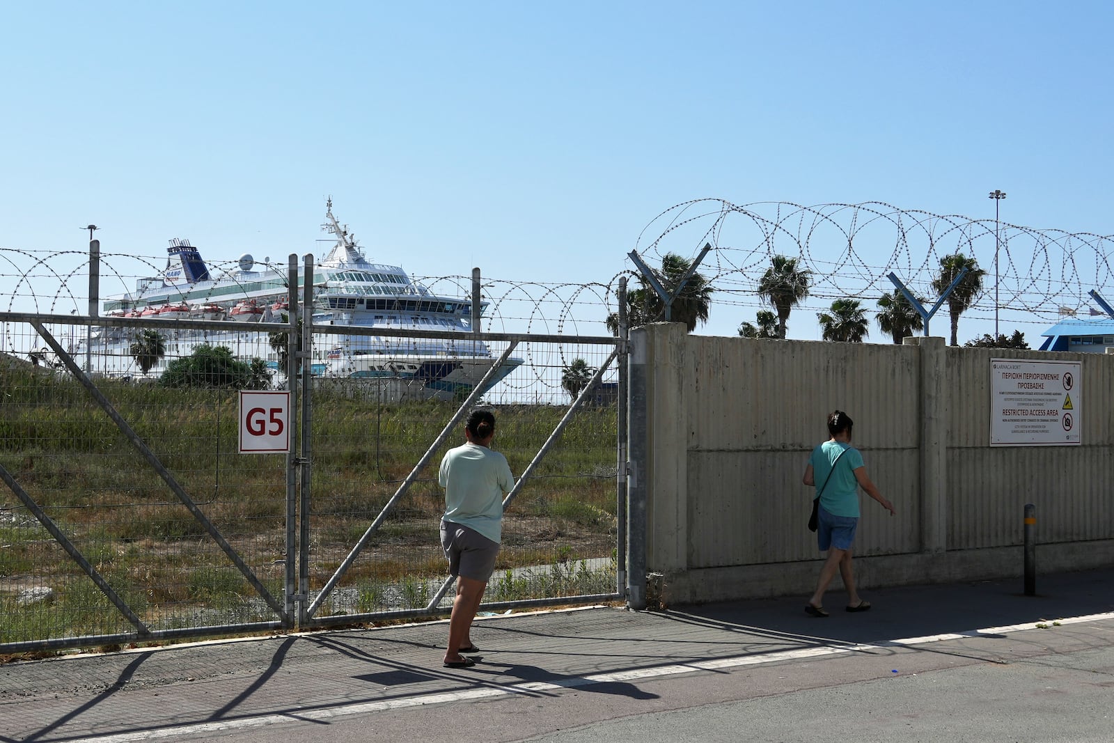 The cruise ship which transported evacuees from Israel is docked at the port of Larnaca, Cyprus, Wednesday, June 18, 2025. (AP Photo/Petros Karadjias)