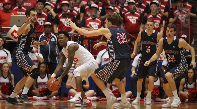 Dayton’s John Crosby looks to make a pass against Saint Mary’s on Saturday, Nov. 19, 2016, at UD Arena. David Jablonski/Staff