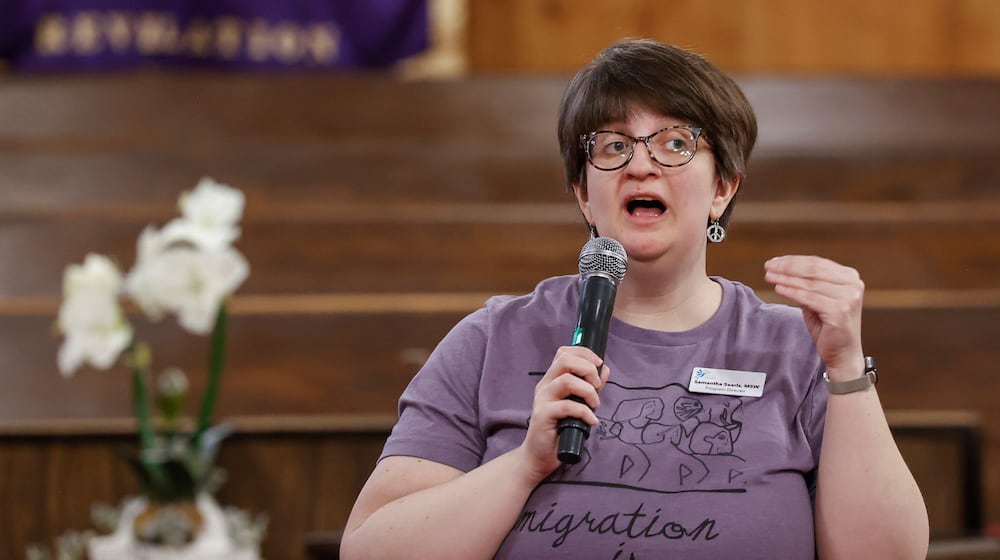 Ignite Peace program director Samantha Searls speaks during a community safety meeting "Be a Neighbor: Building a Better Springfield For All," hosted by the Amos Project on Thursday, Jan. 29, 2026, at Zion Hill Baptist Church. Organizers gathered to share tools and guidance with expected ICE activity after the Temporary Protected Status expires on Tuesday, Feb. 3, 2026. JOSEPH COOKE / STAFF
