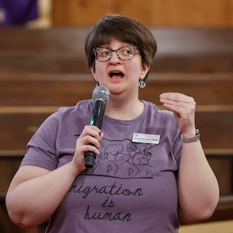 Ignite Peace program director Samantha Searls speaks during a community safety meeting "Be a Neighbor: Building a Better Springfield For All," hosted by the Amos Project on Thursday, Jan. 29, 2026, at Zion Hill Baptist Church. Organizers gathered to share tools and guidance with expected ICE activity after the Temporary Protected Status expires on Tuesday, Feb. 3, 2026. JOSEPH COOKE / STAFF