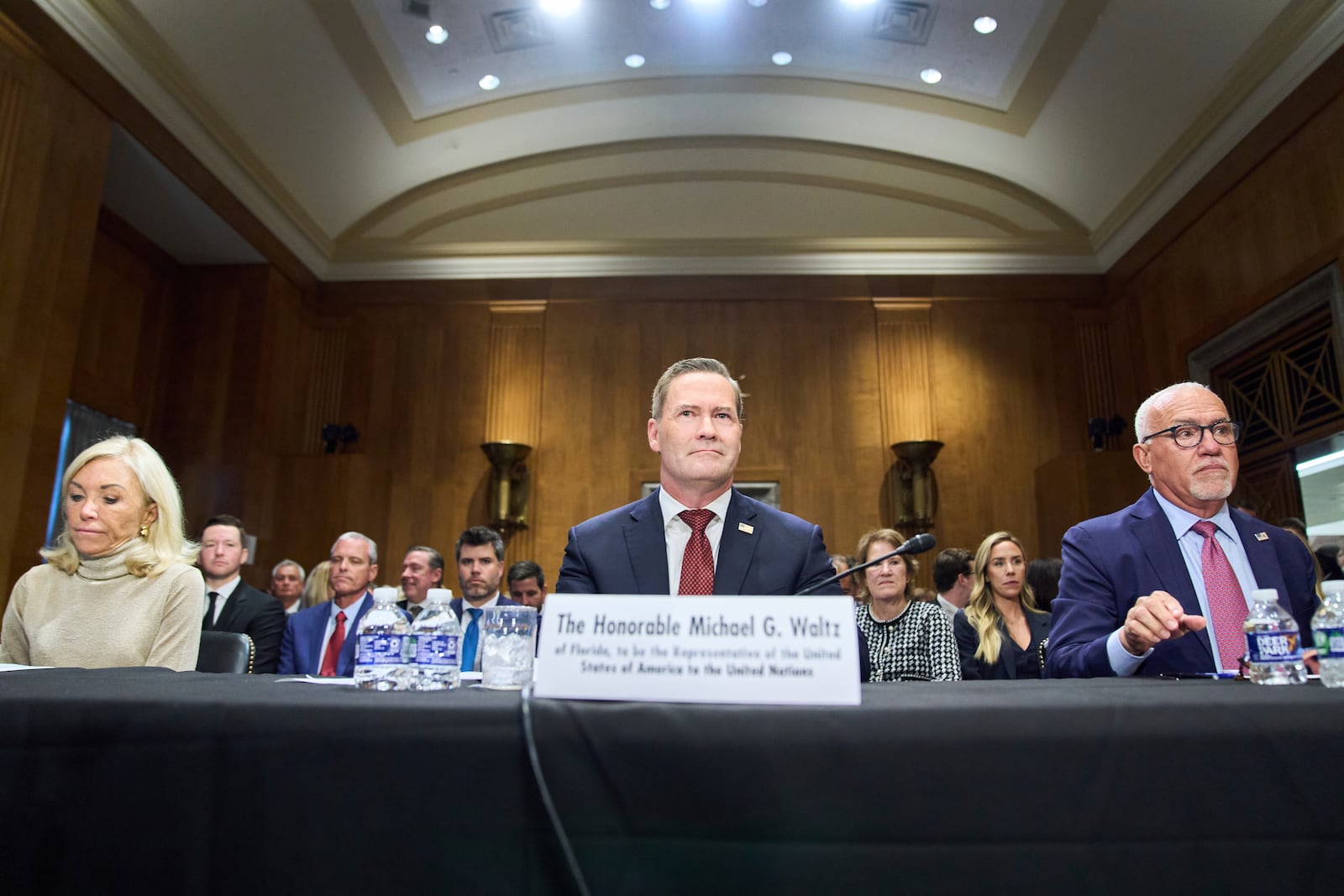 Christine Toretti, left, nominee for U.S. Ambassador to Sweden, former White House National Security Adviser Michael Waltz, nominee for U.S. Representative to the United Nations, and John Arrigo, right, nominee for U.S. Ambassador to Portugal, attend a Senate Foreign Relations Committee nomination hearing, Tuesday, July 15, 2025, on Capitol Hill in Washington. (AP Photo/Jacquelyn Martin)