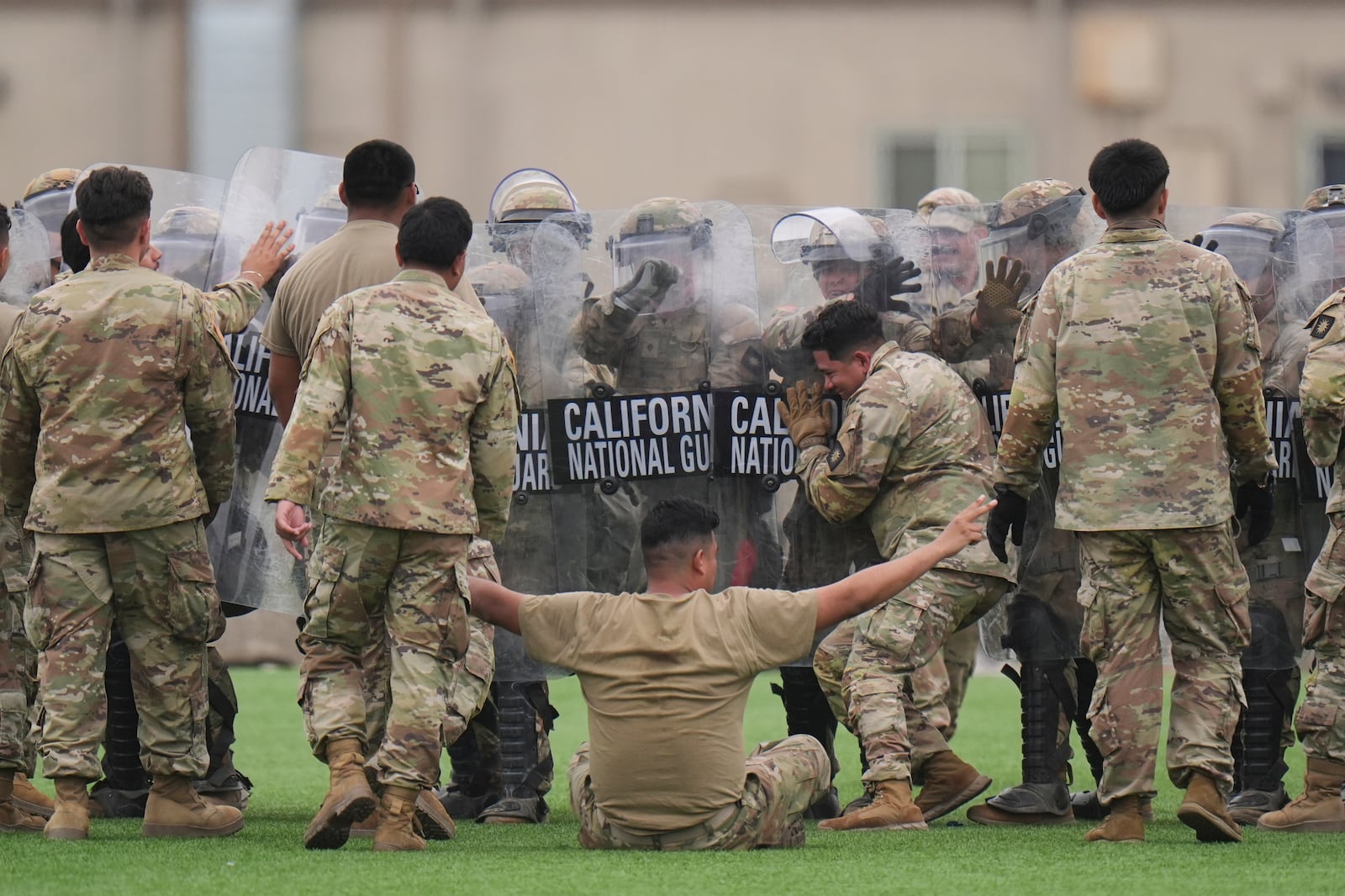 Members of the California National Guard conduct exercises after being deployed to the Los Angeles protests Wednesday, June 11, 2025, in Los Alamitos, Calif. (AP Photo/Jae C. Hong)