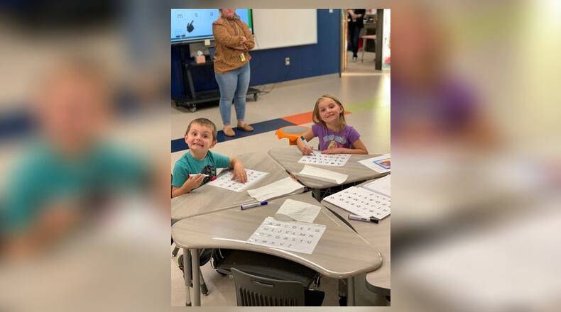 Bronson and Emmylou practiced tracing the correct letter formation at Clark-Shawnee Elementary Title 1 Literacy Night. Contributed