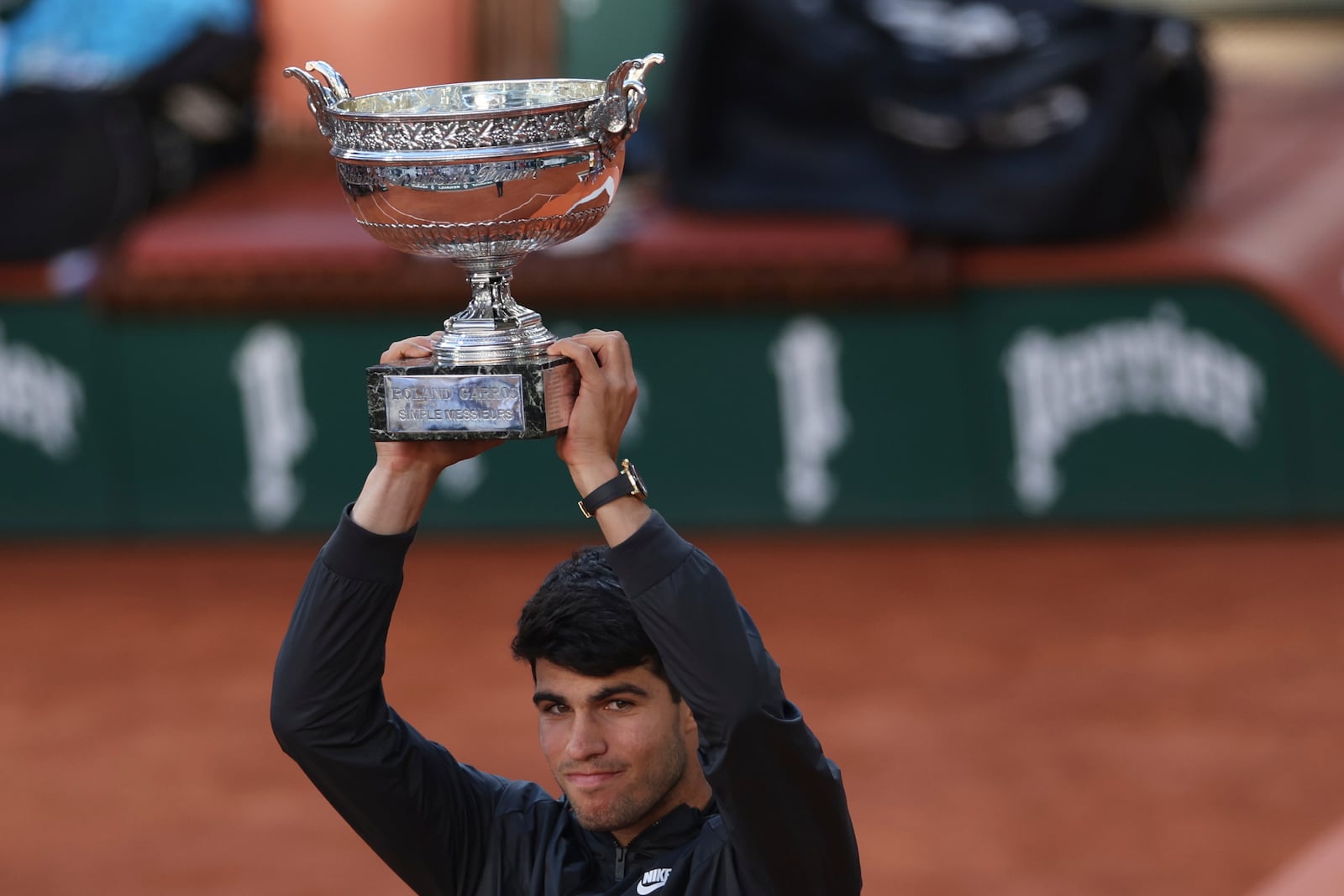 FILE - Winner Spain's Carlos Alcaraz celebrates with the trophy as he won the men's final match of the French Open tennis tournament against Germany's Alexander Zverev at the Roland Garros stadium in Paris, June 9, 2024. (AP Photo/Aurelien Morissard, File)