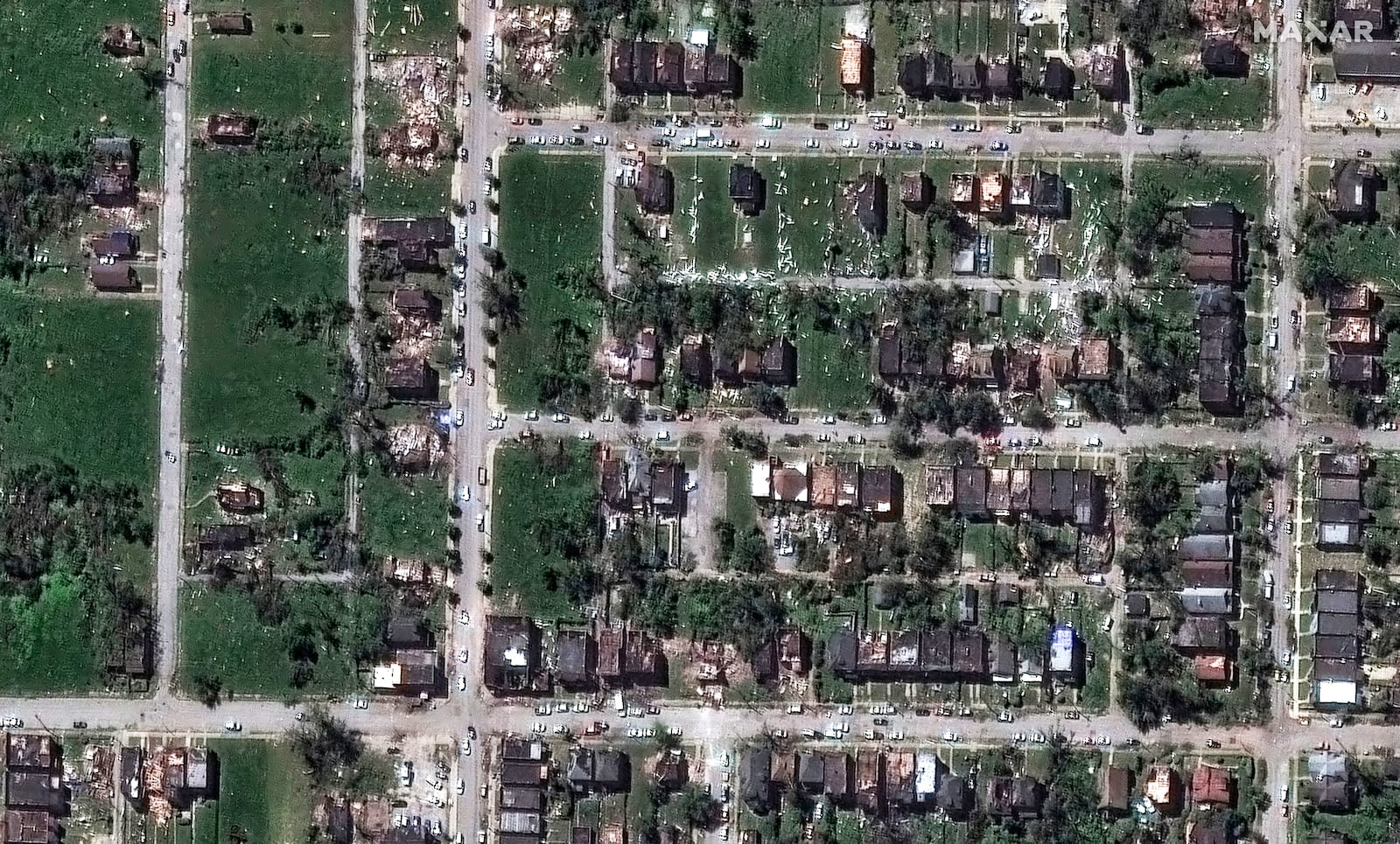 This satellite image provided by Maxar Technologies shows houses after they were damaged by a tornado near Ashland Avenue, Monday, May 18, 2025, in northwest St. Louis. (Maxar Technologies via AP)