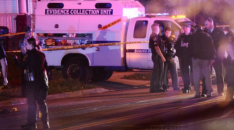 Springfield Police Division officers are shown on the scene of mass shooting Sunday morning May 1, 2022. One person was fatally shot and four others were transported to hospitals with gunshot wounds. MARSHALL GORBY \STAFF