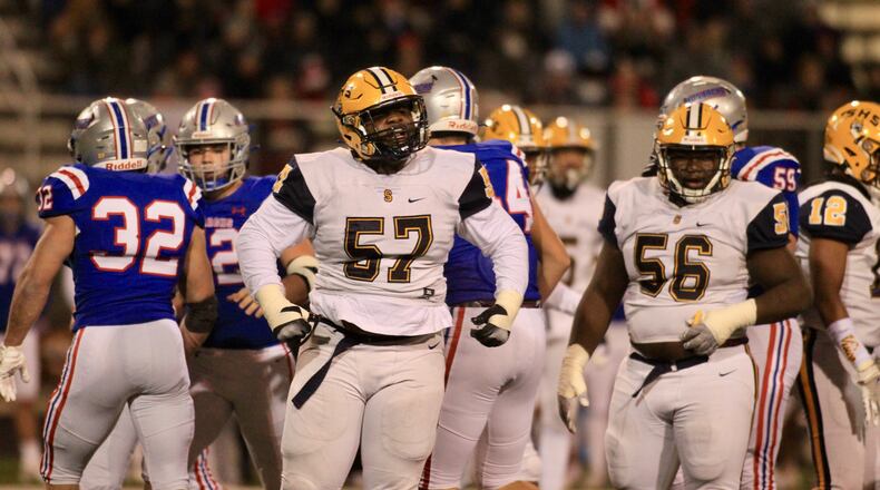 Springfield defensive linemen Jokell Brown and Tywan January line up for a play against Marysville in a Division I regional final on Nov. 19, 2021, at Hilliard Darby High School. David Jablonski/Staff